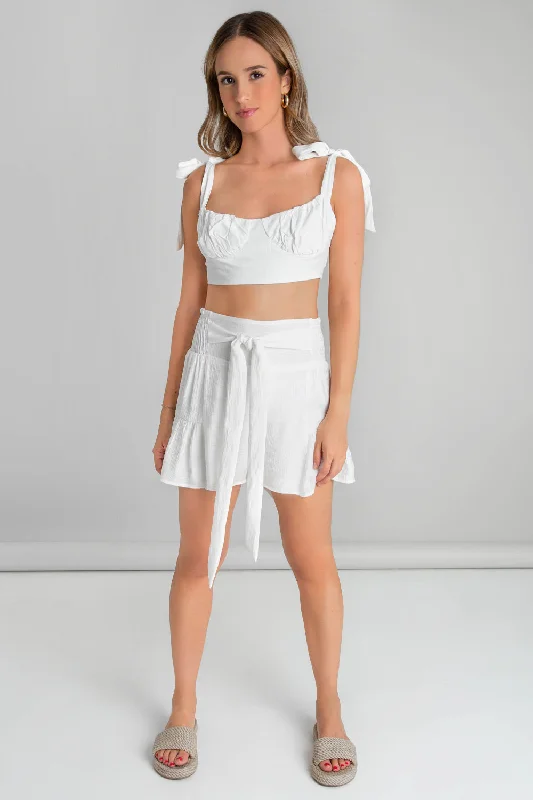Falda short corte en a con olanes lazo frontal